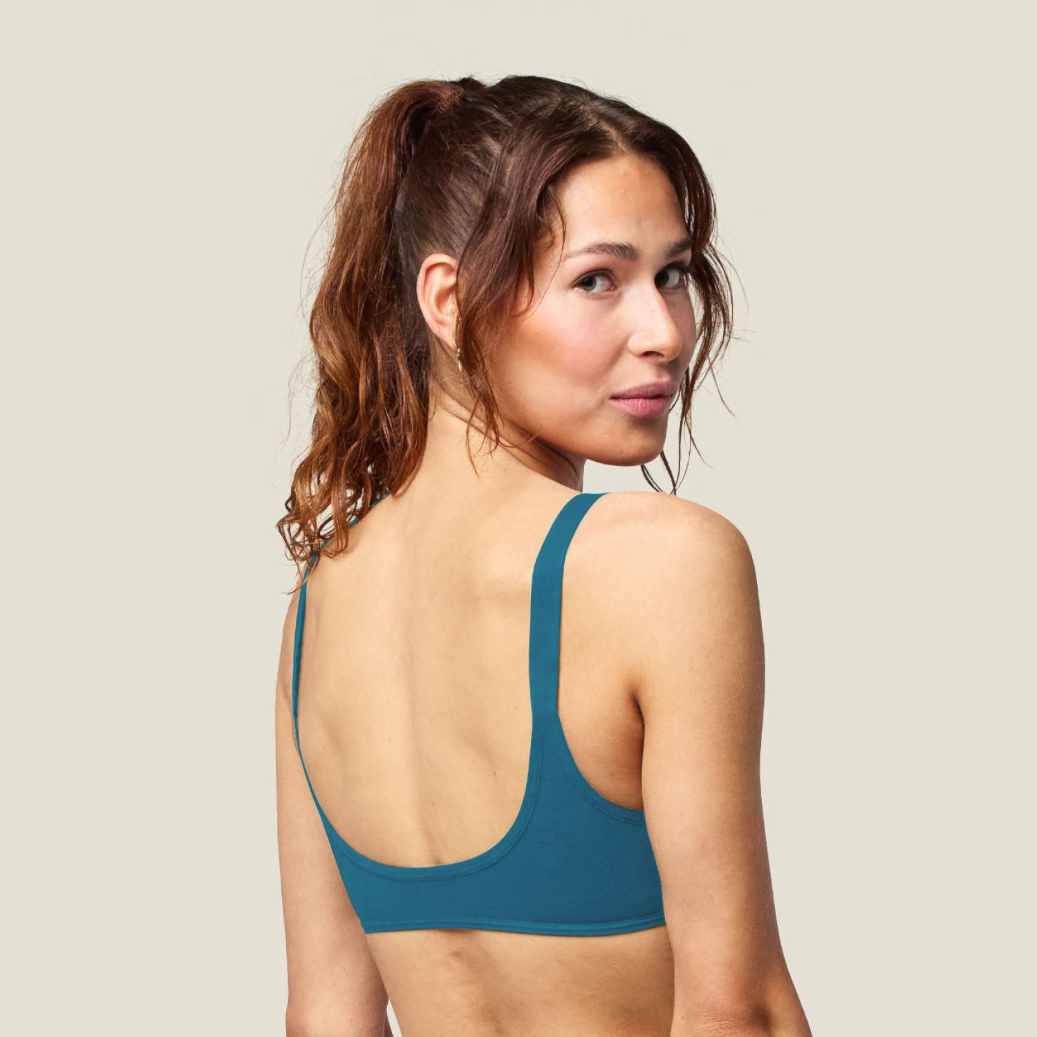 Teen Swim Bikini Top in Blue shown from the back, highlighting the smooth, low-back design with supportive straps.