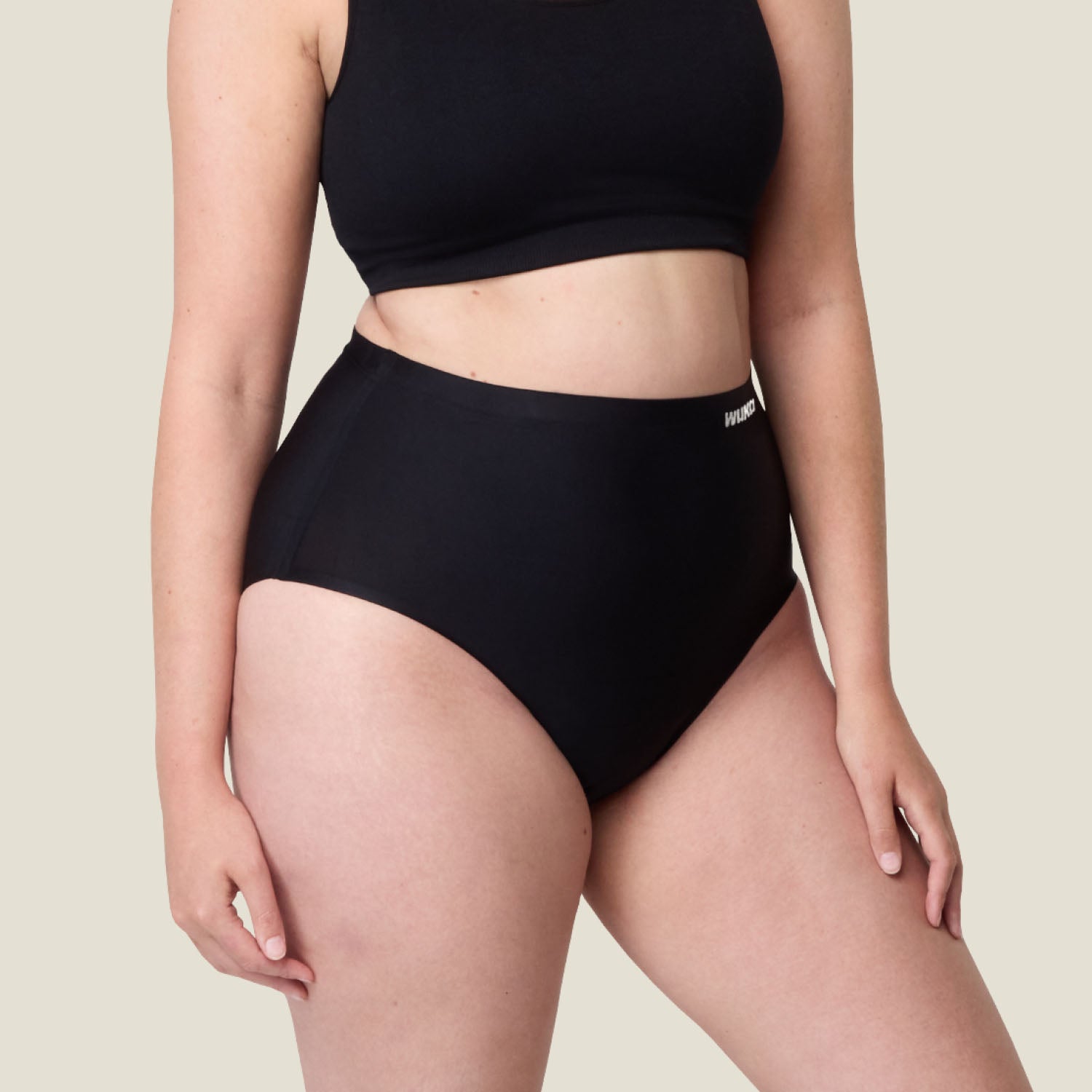 Side profile of WUKA black high-waisted period underwear, highlighting stretch fabric and ultra-absorbent gusset for maximum comfort and protection.