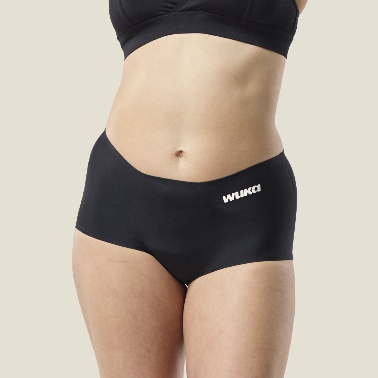 Front view of WUKA Teen Stretch™ Period Boxer in black, leak-proof period protection in a soft stretch fit.