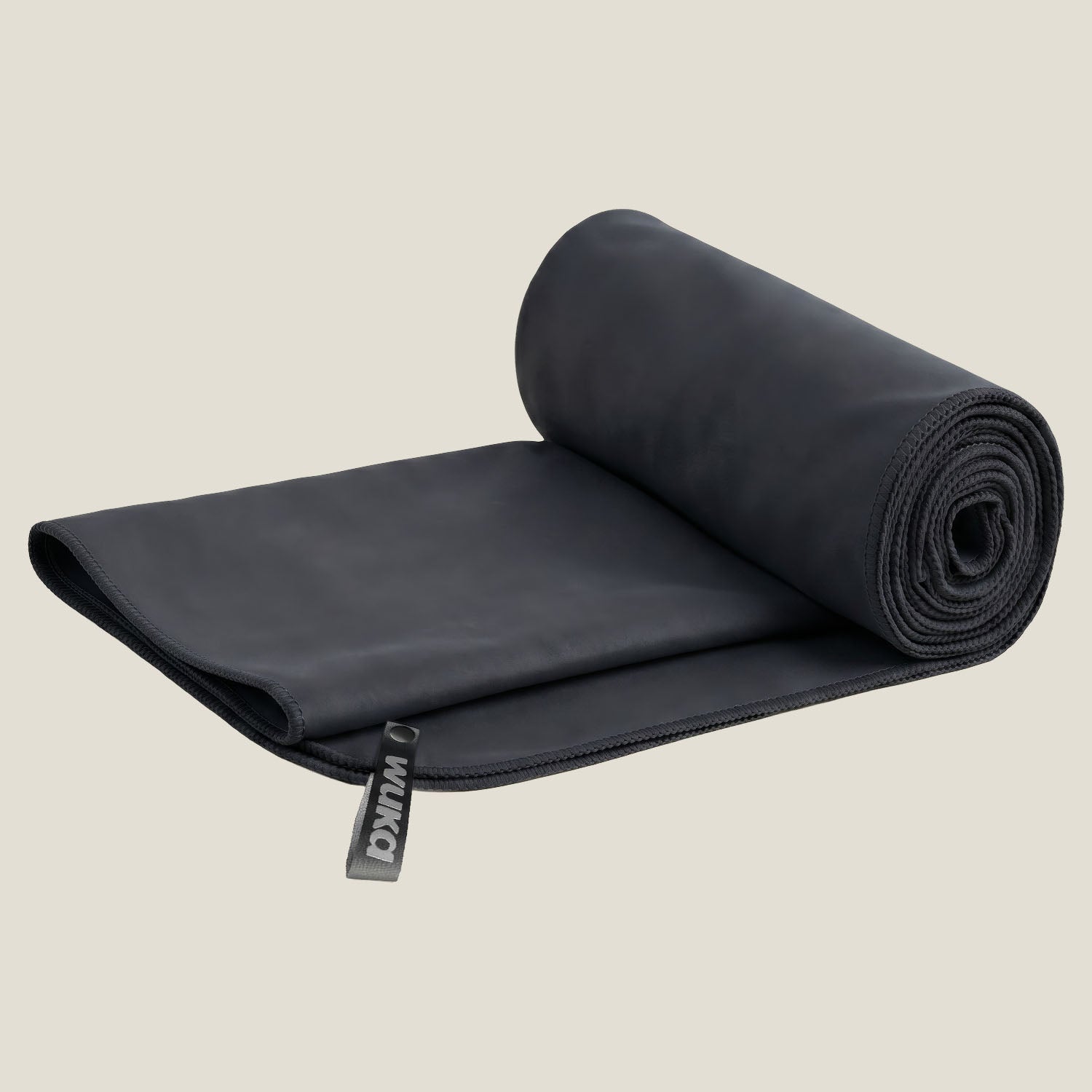 WUKA black quick-dry microfibre pool towel rolled up — packable swim chamois towel